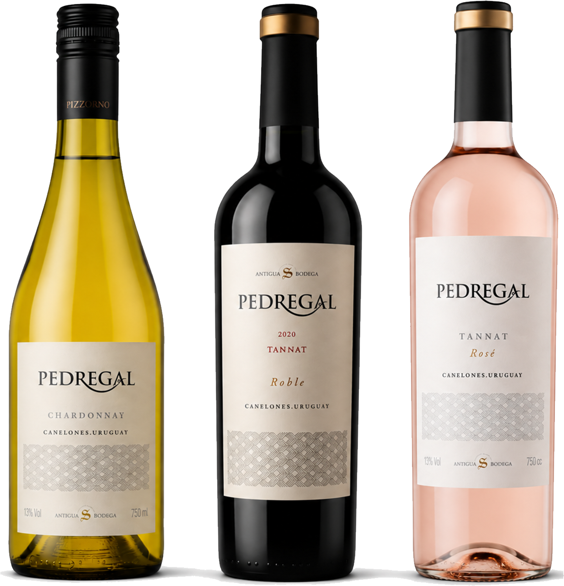Three Pedregal wine bottles on a white background: a yellow-green Chardonnat, a dark red Tannat 2020, and a pale pink Rosé. The center bottle is slightly larger and more prominent than the other two.